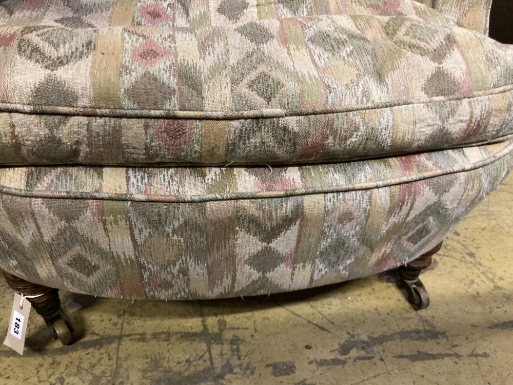 A late Victorian upholstered armchair